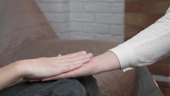 Woman help daughter with hands. alt