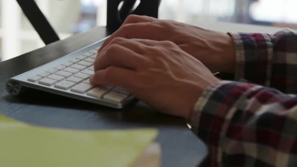 Young man working in a creative office alt