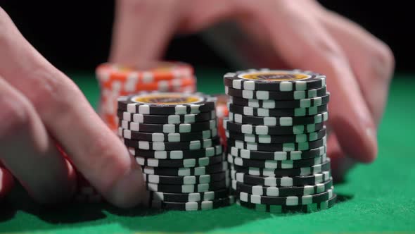 Red and Black Chip Stacks on Green Gaming Table