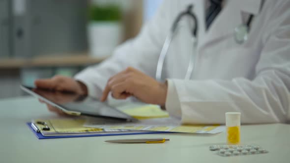 Head Physician Consulting Patient Online Using Tablet, Modern Technologies alt