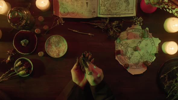 Witch Throwing Magical Stones Top View alt