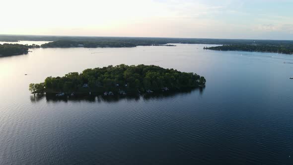 aerial video of lonely island found in  Lake Minnetonka, Minnesota during summer time alt