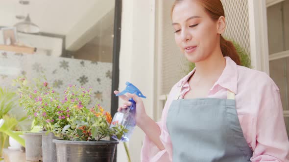 gardening shop beautiful own keeper spray water to plants with foxy in flower shop alt