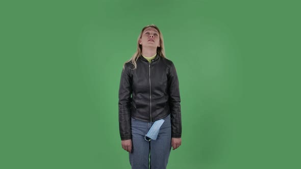 Portrait of Beautiful Young Woman Is Looking Straight . She Has Temperature Is Coughs and Covers alt