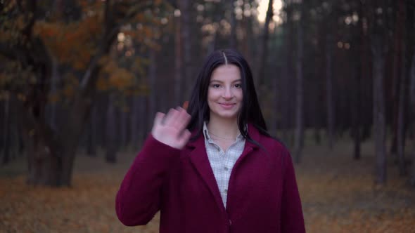 Smiling Woman Looking at Camera Saying HELLO Running To Camera and Waving Hand