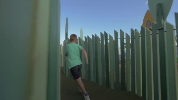Boy Having Fun on Large Playground alt