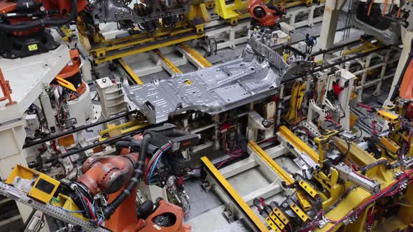 Production of an Electric Vehicle in a Factory Welding Work is Done By Robots