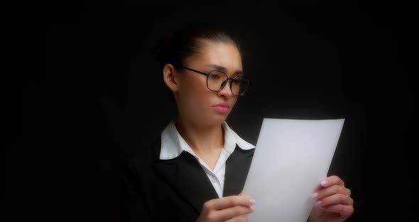 Businesswoman Tears Up and Throws Away White Sheets of Paper