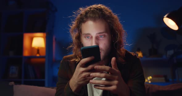 Millennial Hipster Man with Earrings Dictating Voice Message and Sending It. Young Handsome Guy alt