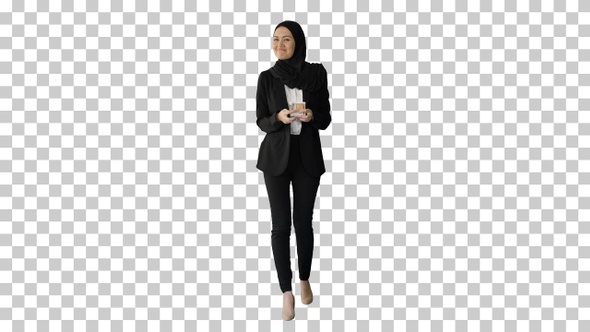 Pretty woman in hijab walking and counting money, Alpha Channel alt