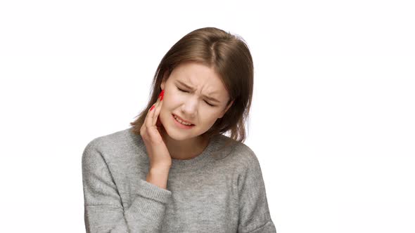 Portrait of Pretty Woman with Long Hair Suffering From Toothache with Touching Cheek While alt