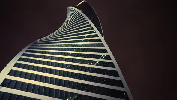 Futuristic Glass Skyscraper in Moscow at Night