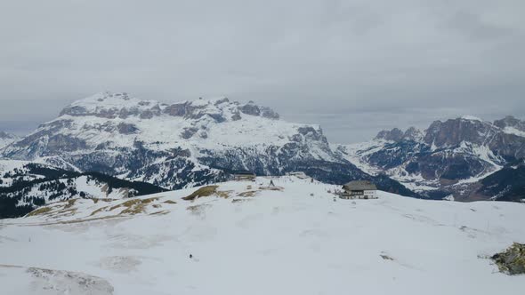 Aerial, Ski Facilities On Top Of Snowy Dolomites Mountains In Italy