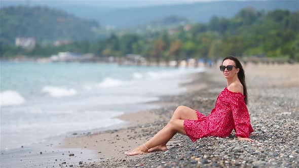 Young Beautiful Woman Relax on the Beach