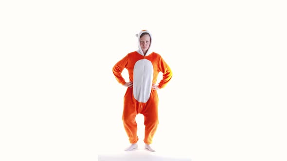 Crazy Woman in Kigurumi Costume on a White Background in the Studio Dancing Dance