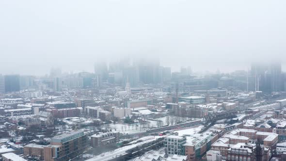 Aerial drone shot towards London City centre on a snow day January 2021 alt