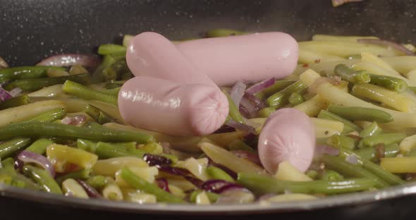 Cooking In A Pan. Throw Asparagus With Sausages. Cooking