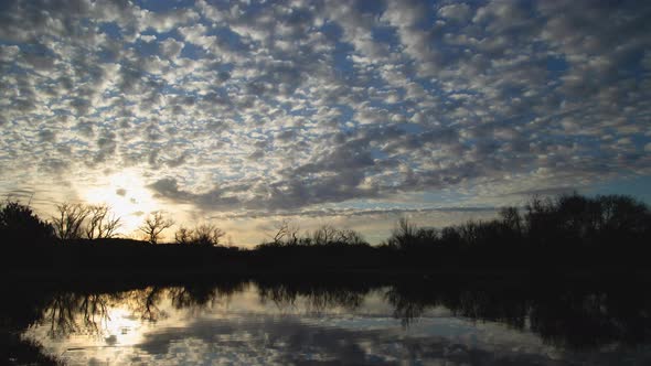 Brilliant Sunrise Clouds Over Lake Timelapse