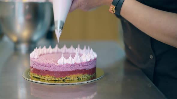 Confectioner Decorates Cake and Conducts Cooking Lesson alt