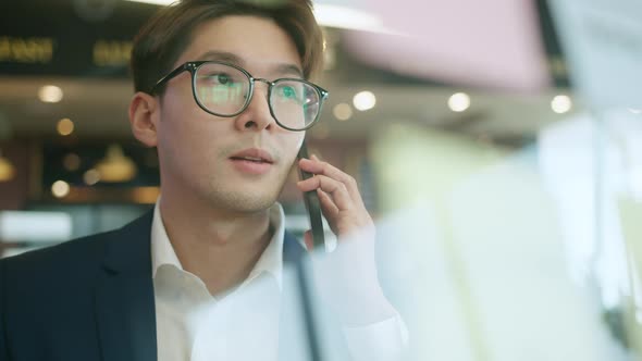 Smart attractive positive asian business male wearing glasses work remote new normal lifestyle