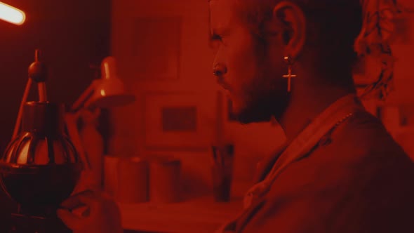 Young Indian Photographer in Darkroom alt