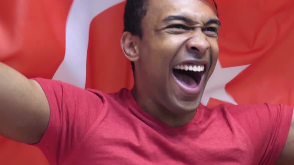 Turkish Fan Cheering for Turkish Team alt