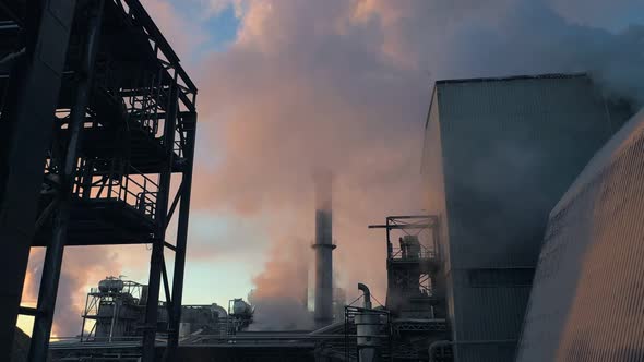 Clouds of Thick Smoke are Pouring Out of the Plant's Pipes
