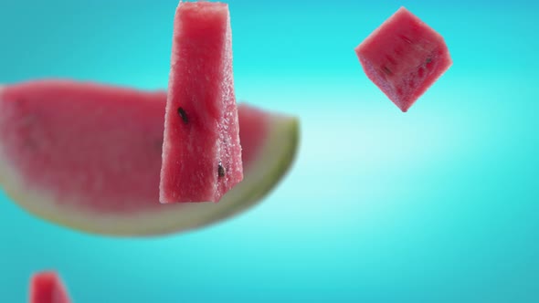 Flying of Watermelon and Slices in Ice Blue Background alt