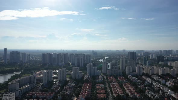 Drone fly in shot of Ultra modern city with river, green space,  high rise buildings and urban spraw alt