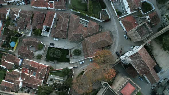 Roofscape Of Ancient Village And Medieval Castle With Dense Forest Hilltop In Obidos, Portugal. - Ae alt