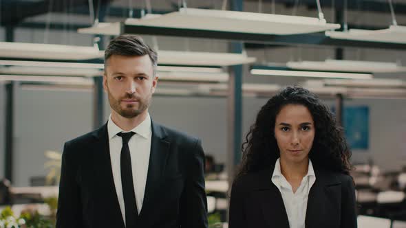 Male And Female Business Colleagues Posing Standing In Modern Office alt