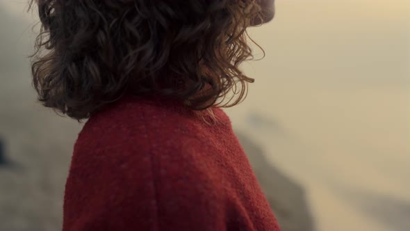 Woman Standing Sea Beach at Sunrise alt