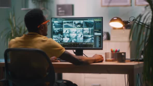 Black Security Worker Working From Home alt