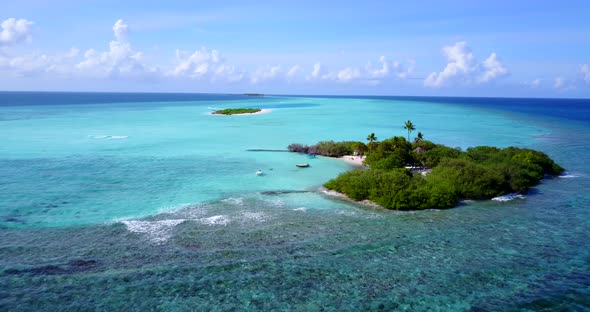 Luxury drone island view of a white sandy paradise beach and aqua blue water background in colourful alt