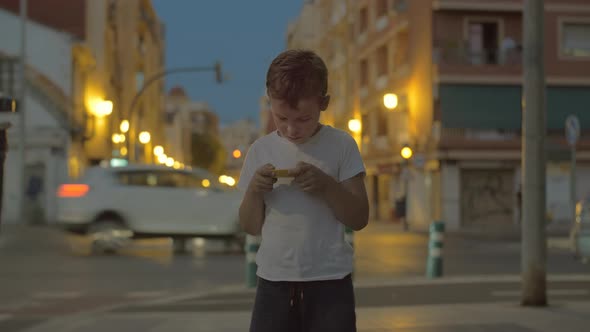 Child with maze toy outside in the evening alt