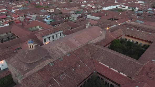 Daytime 4k drone aerial footage over Spanish colonial houses from the center of Cusco City, Peru dur alt
