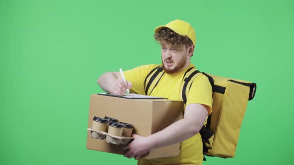 Portrait of Young Men Fills Out Delivery Documents Holding Parcel and Coffee alt