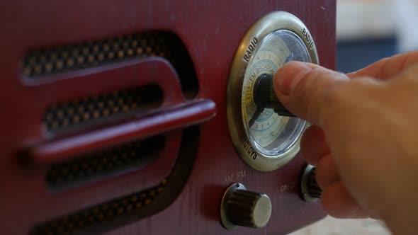 Close-up of Male Hand Turns On a Retro Radio