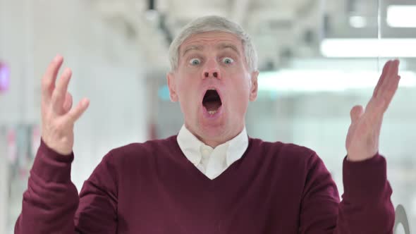 Upset Middle Aged Man Reacting To Failure  alt