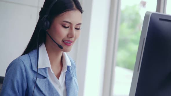 Customer Support Agent or Call Center with Headset Talking to Customer on Phone alt