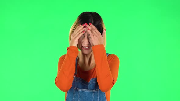 Woman Suffering From Headache From Fatigue. Green Screen alt