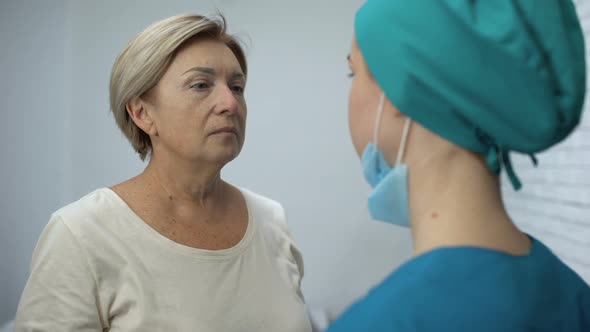 Nurse Telling Mature Patient Shocking News Terrified Woman Crying