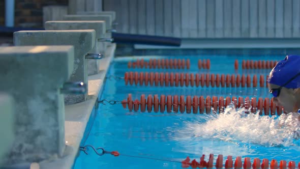 Female swimmer cheer at finishing line of swimming pool 4k alt