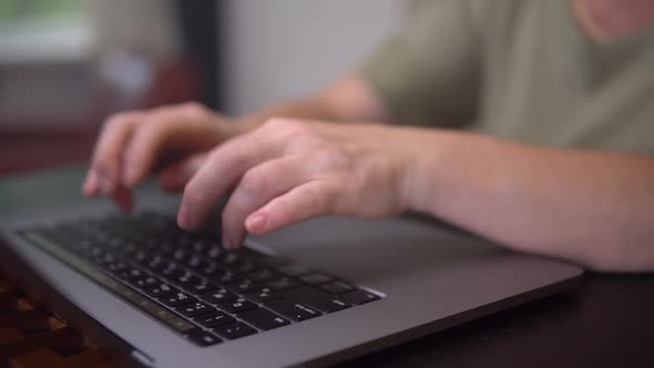 Concentrated Aged Women is Surfing Online on the Laptop