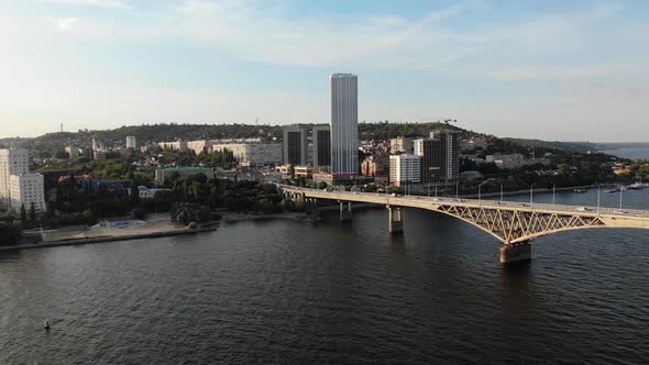 Aerial View of a Cinematic Nice Long Bridge with Cars in Saratov City alt