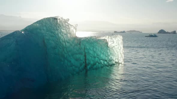 Amazing Drone View of Iceberg Shining in a Sunny Day of Breidamerkurjokull Glacier Tongue in Iceland alt