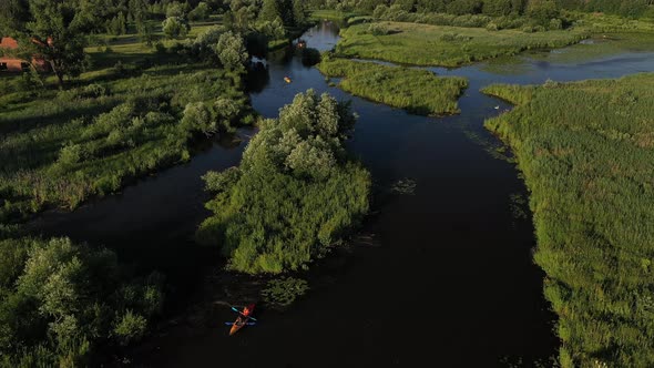 Top View of the Svisloch River Kayakers Floating on the River in the City's Loshitsky Park at Sunset alt