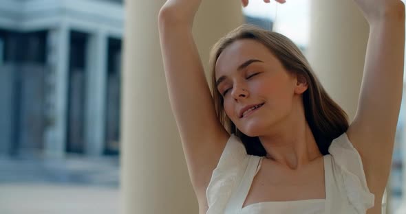 Young Dancer in White Dress Dances on the Stairs of the Theatre in Slow Motion Balerina Does Dance alt