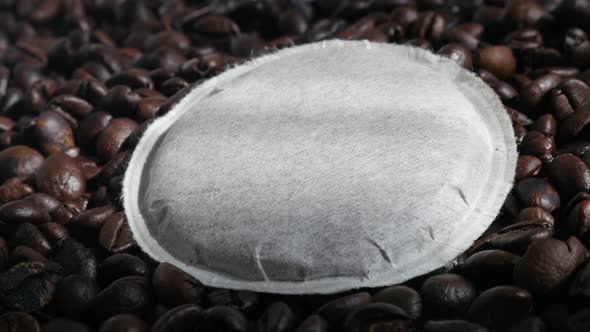 Unused coffee pod filter and roasted beans panning 4K footage