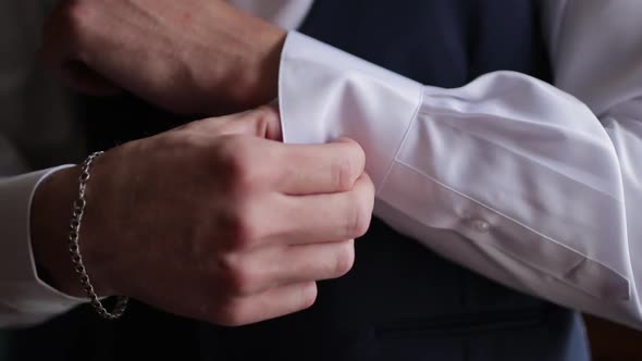 White Caucasian Man Fixing His Cuff Links on His Dress Shirt Close Up